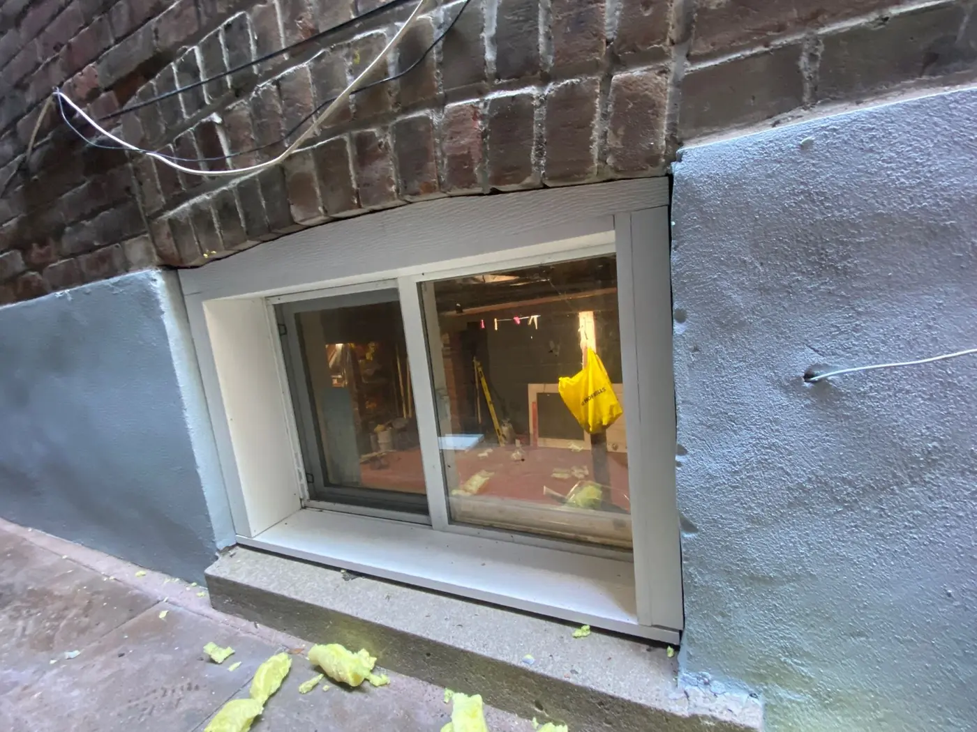 Finished foundation wall and basement window detail