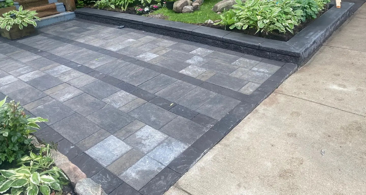 Finished dark interlock driveway and garden border