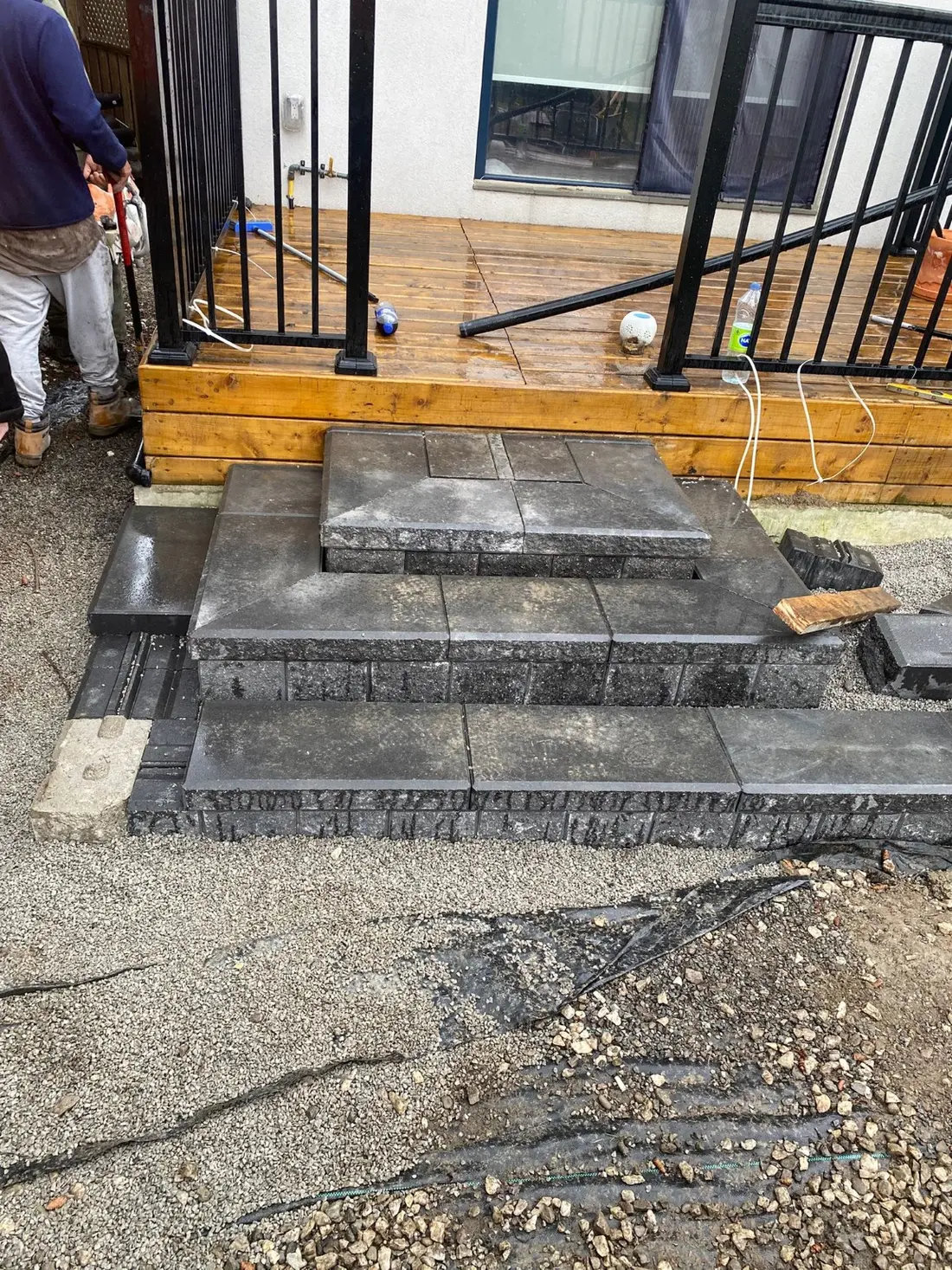 Dark masonry entrance steps under construction